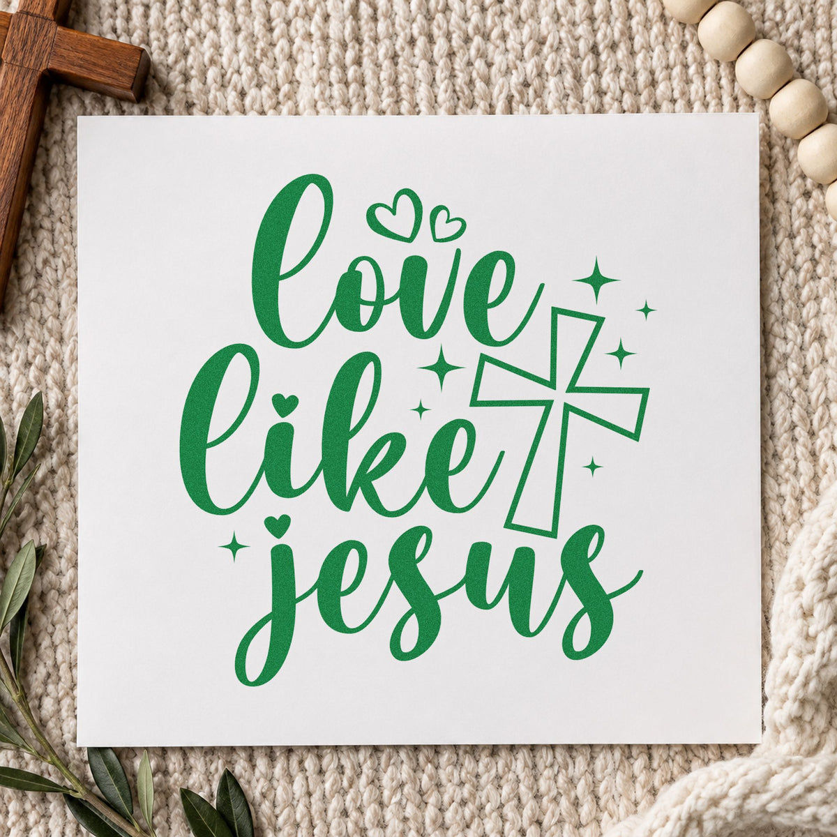 Love Like Jesus craft stamp imprint in green ink on a handmade project, one idea being kindness week notes.