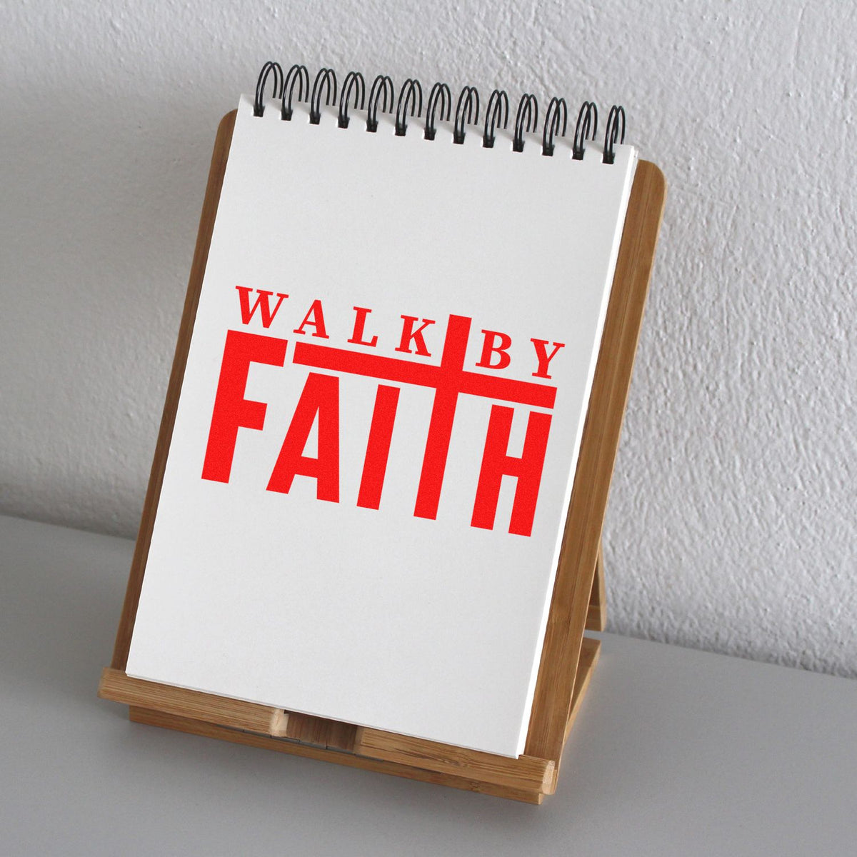 Walk By Faith rubber stamp design on spiral notepad, perfect for faith-based stationery, journals, and custom religious stamps.