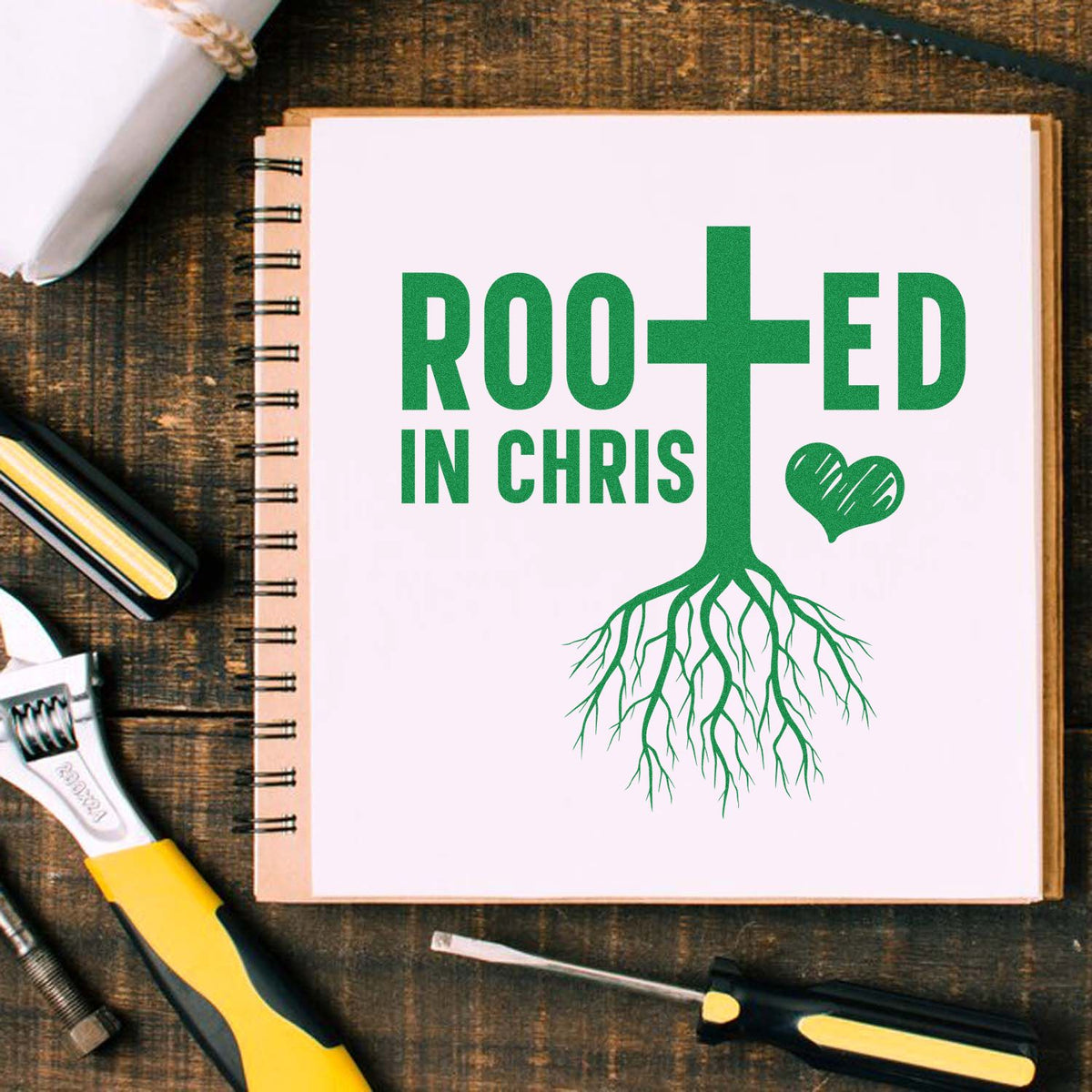 Rooted in Christ rubber stamp design featuring a cross, roots, and heart for Bible journaling and faith-based crafts.