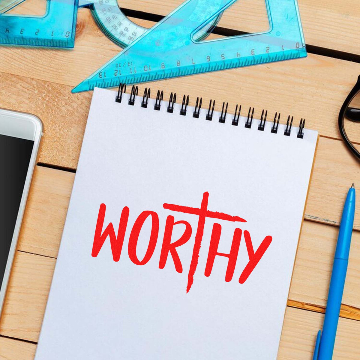 WORTHY rubber stamp impression on notebook for motivational office, school, or handmade project use.
