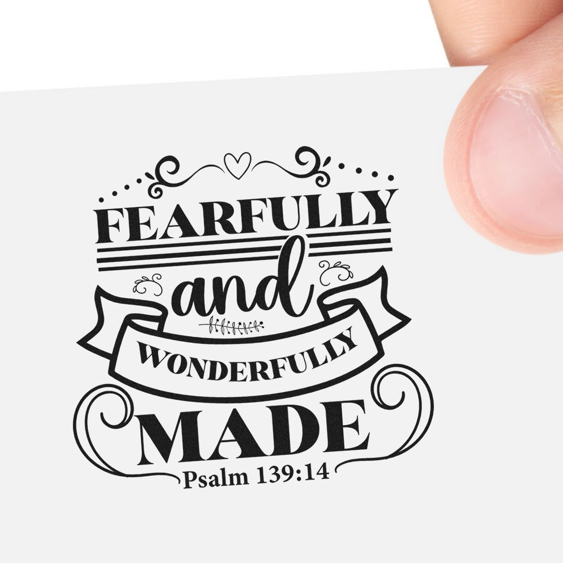 Christian rubber stamp design reading Fearfully and Wonderfully Made with Psalm 139:14 verse on paper.