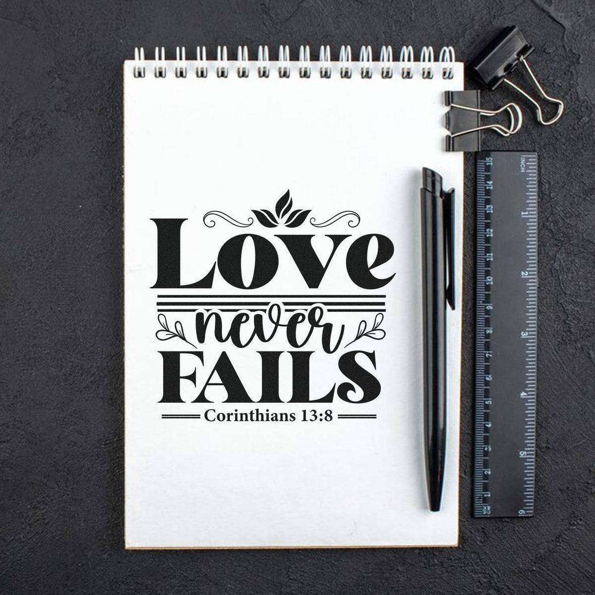 Preview of Christian rubber stamp design featuring Love never fails and Corinthians 13:8 for journals and Bible crafts.