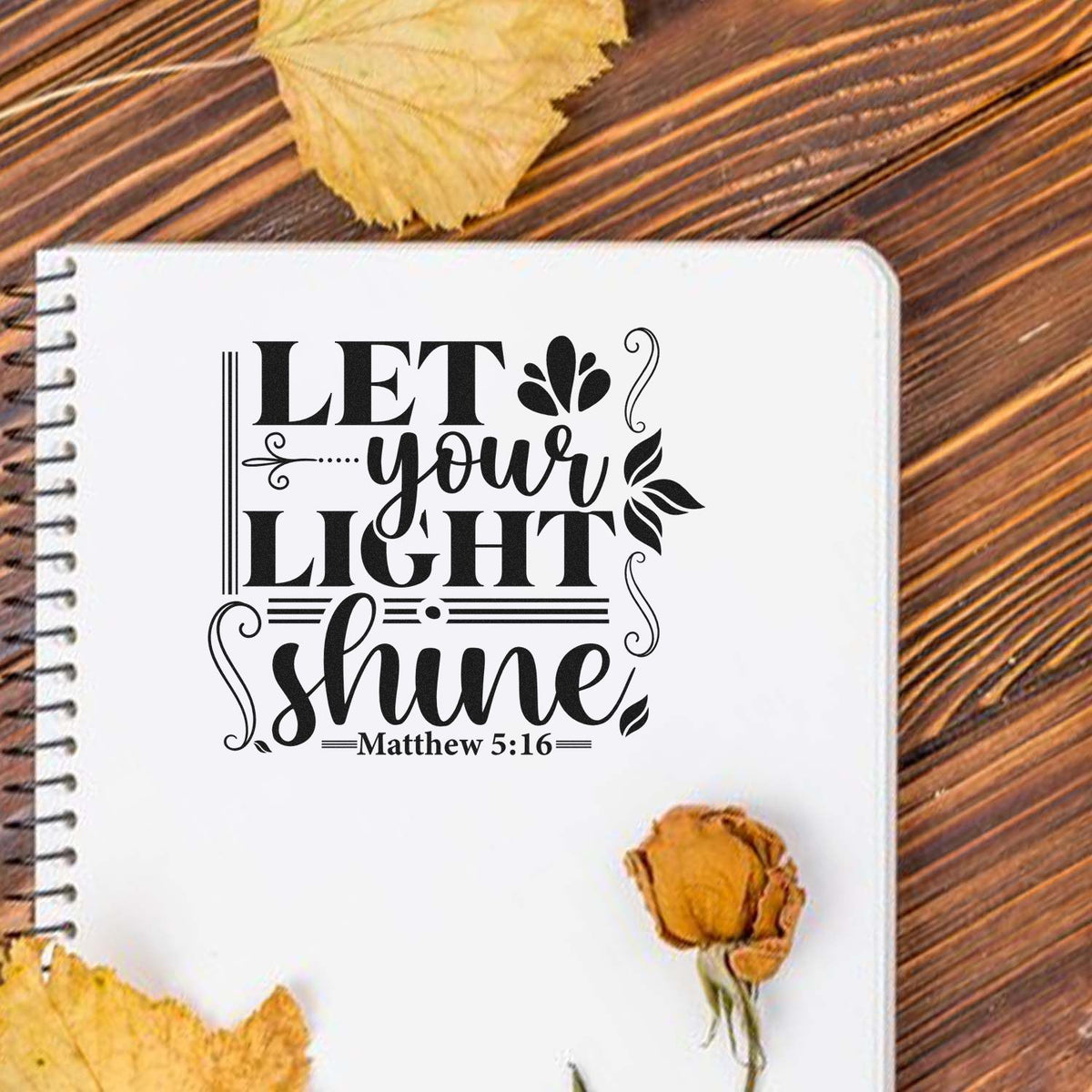 Christian rubber stamp design with Let Your Light Shine Matthew 5:16 quote on a notebook page.
