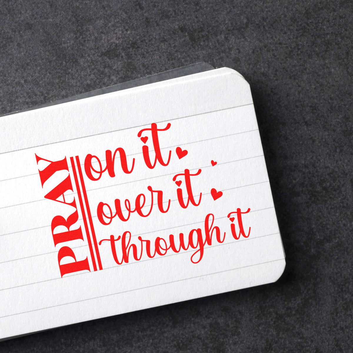 Red custom rubber stamp impression on lined paper with playful script and hearts for journaling or stationery.