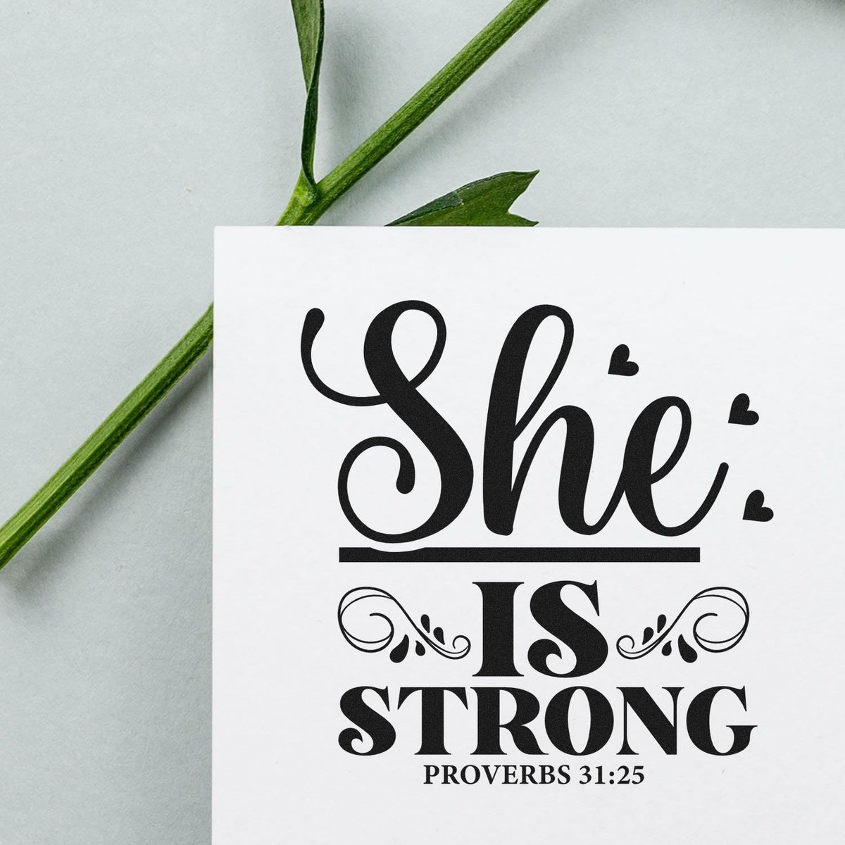 Christian rubber stamp reading She Is Strong with Proverbs 31:25 for Bible verse cards, scrapbooking, and faith gifts.