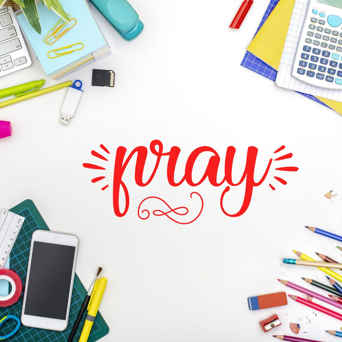 Pray script rubber stamp design surrounded by colorful school supplies, ideal for faith-based crafting and stationery projects.