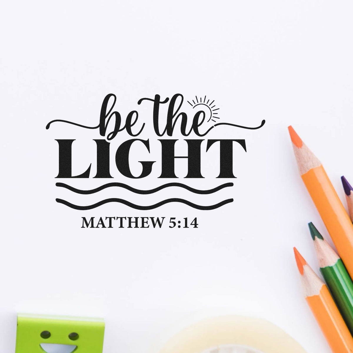 Inspirational Be the Light Matthew 5:14 Christian rubber stamp design with pencils on a white background.