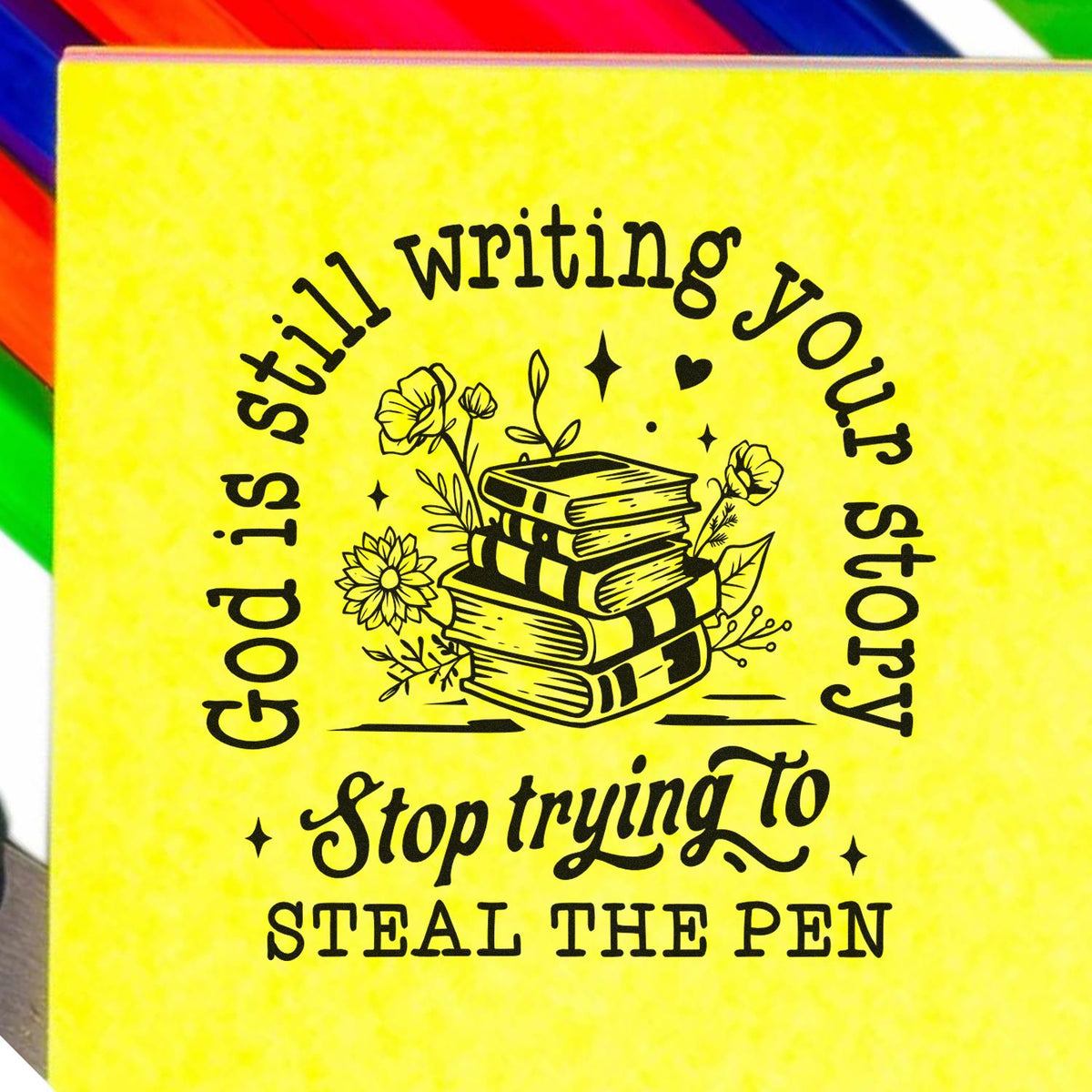 Inspirational rubber stamp design with quote, God is still writing your story; stop trying to steal the pen, with books and flowers.