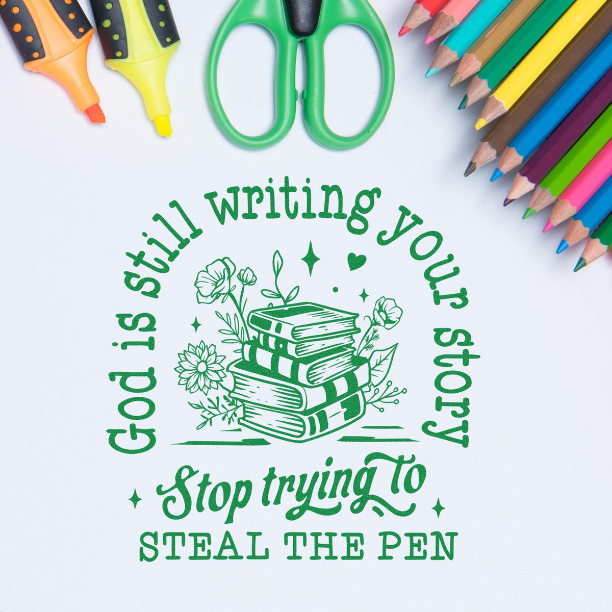 Rubber stamp design reading Still writing your storystop trying to seal the pen, with books, flowers, and pencils.