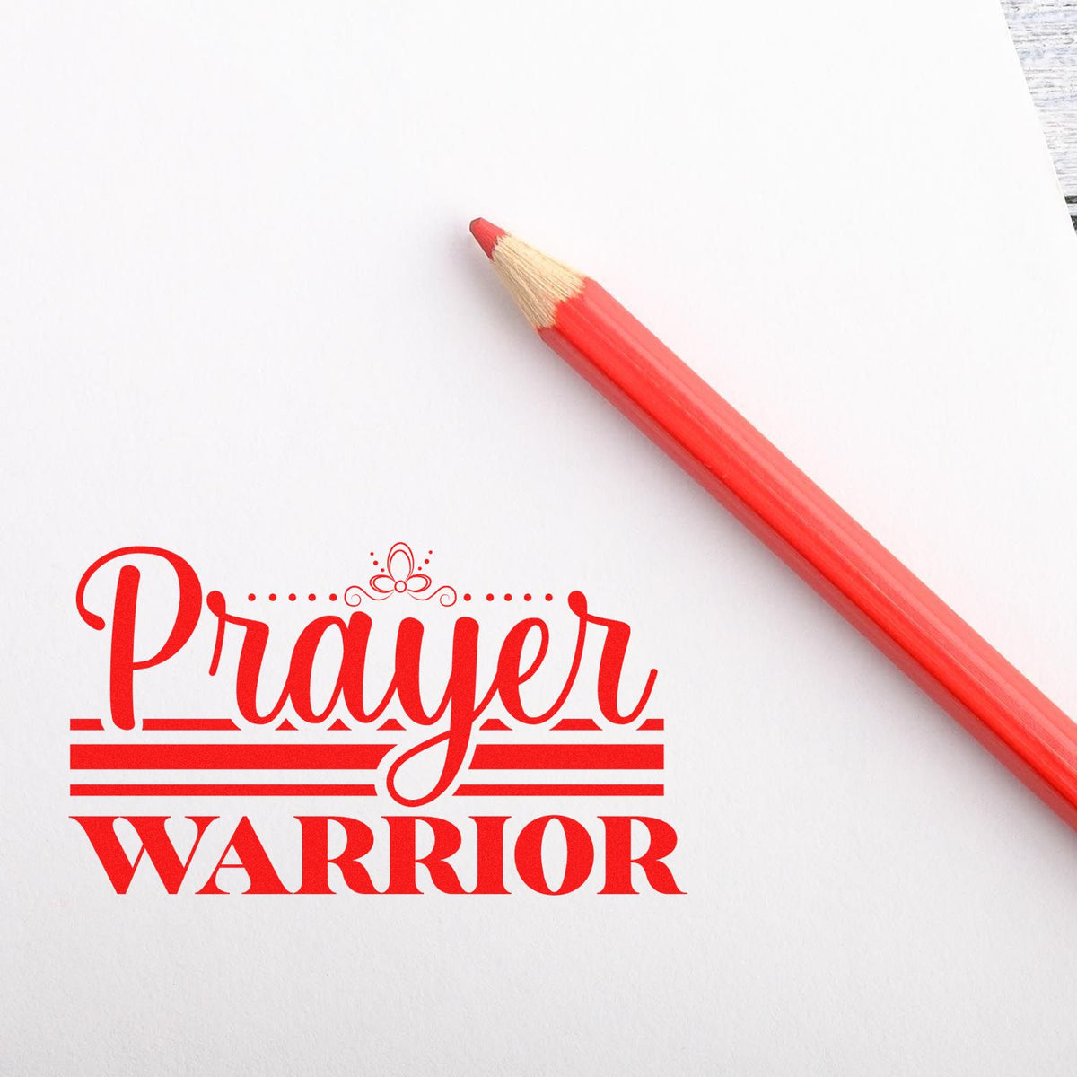 Prayer Warrior rubber stamp design in red with pencil on white paper, ideal for faith-based crafts, journals, and stationery.