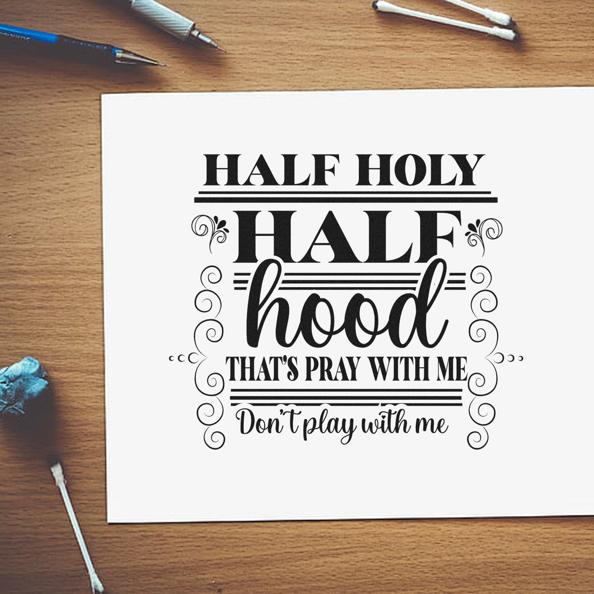 Half Holy Half Hood Scrolls Wood Handle Stamp imprint stamped in black ink. Ornamental scrolls frame "Half holy half hood" and "That's pray with me, don't play with me."