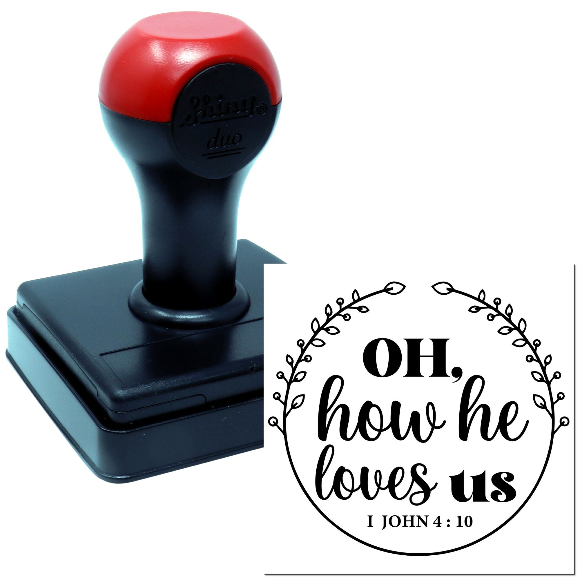 Self-inking rubber stamp with Christian verse design reading Oh, how he loves us and I John 4:10 scripture.