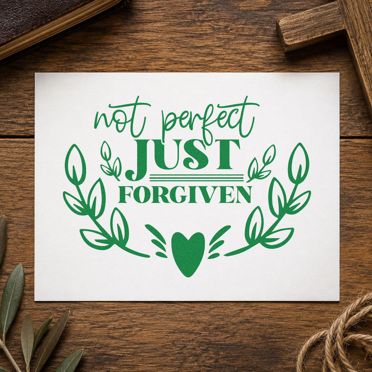 Not Perfect Just Forgiven Wreath craft stamp imprint in green ink on a handmade project, one idea being mom guilt notes.