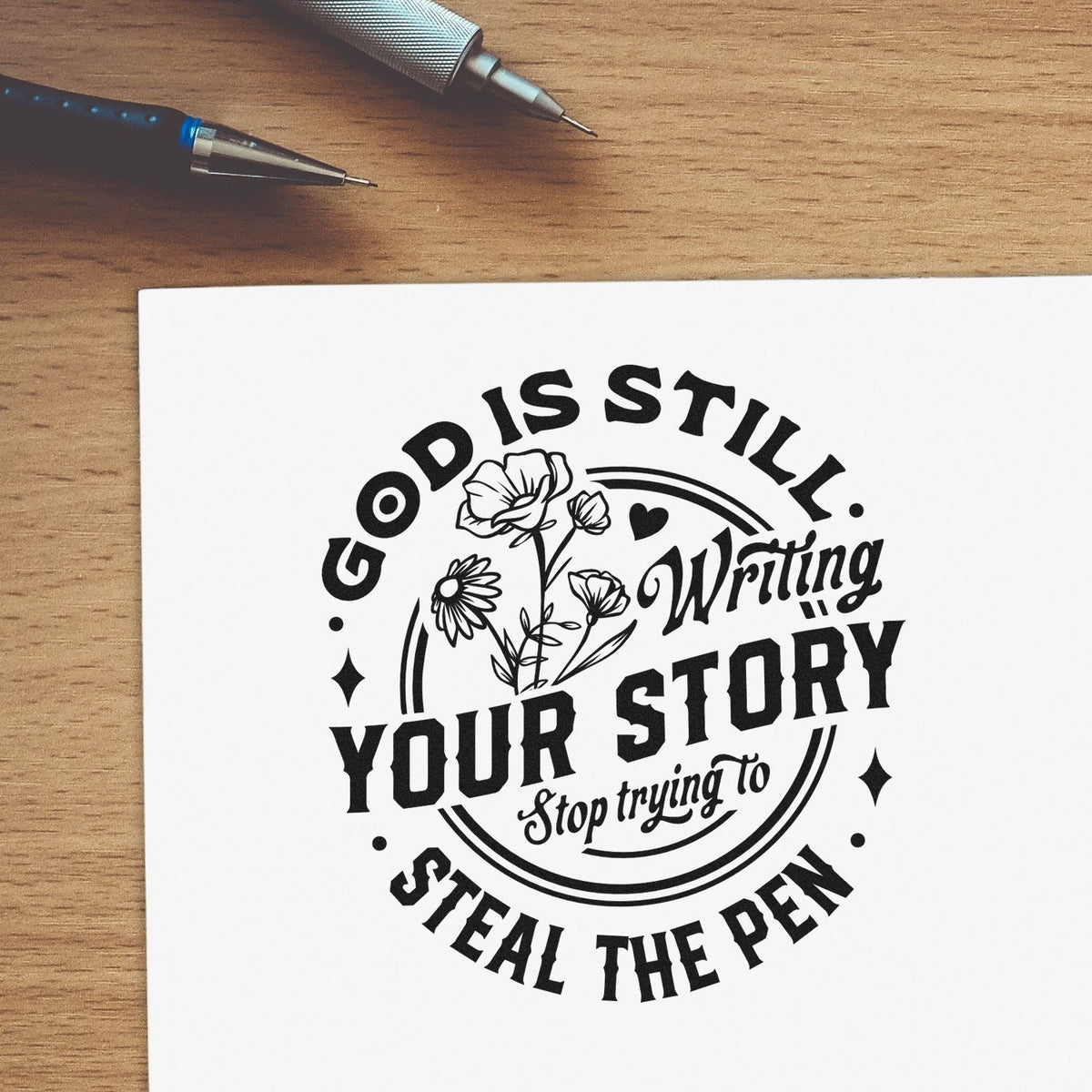 Faith-based rubber stamp with floral quote, God is still writing your story, stop trying to steal the pen, for paper crafts.