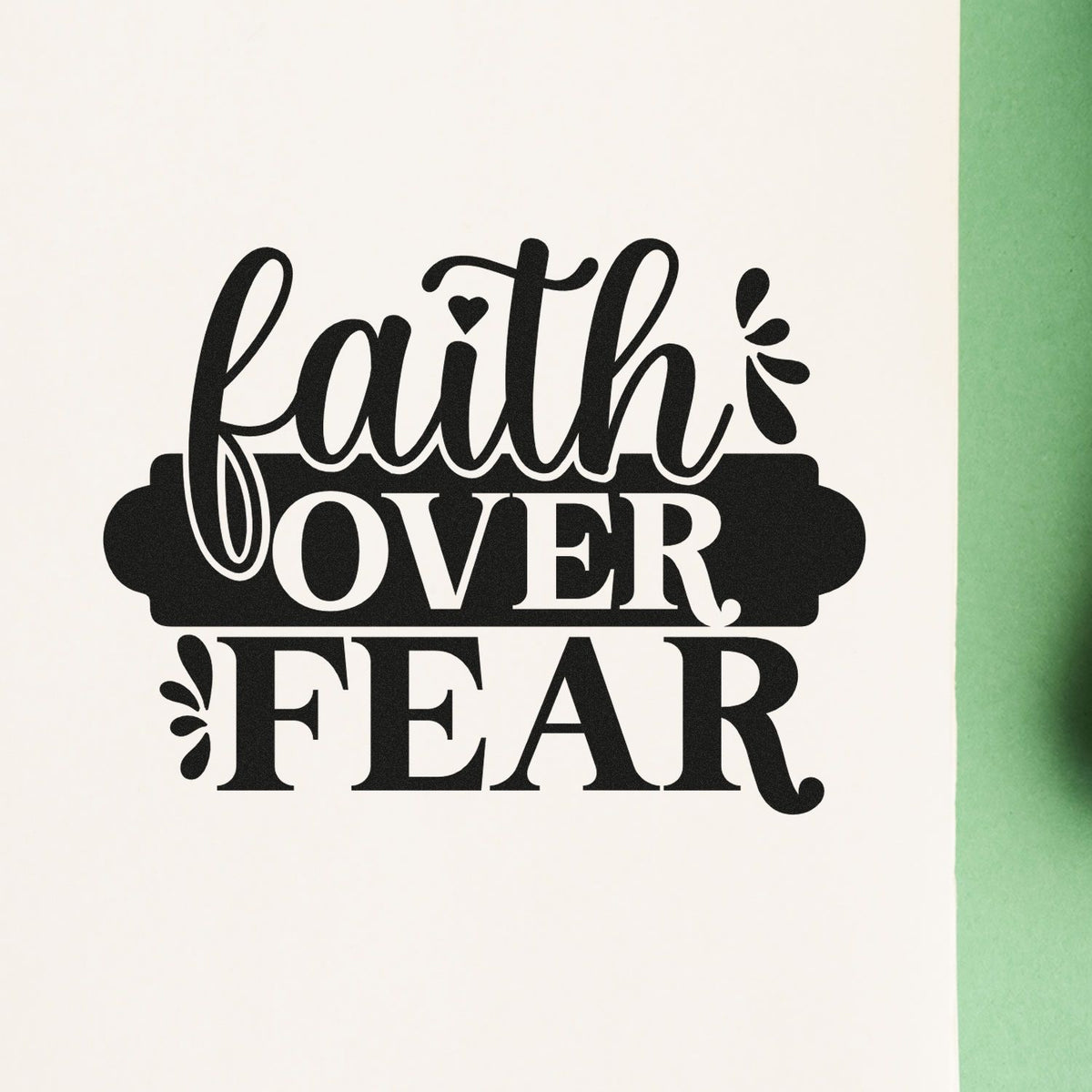 Faith Over Fear Banner Compact Pre-Inked Stamp – Slim imprint stamped in black ink. A dark rounded banner emphasizes "Over" between "Faith" script and bold "Fear."