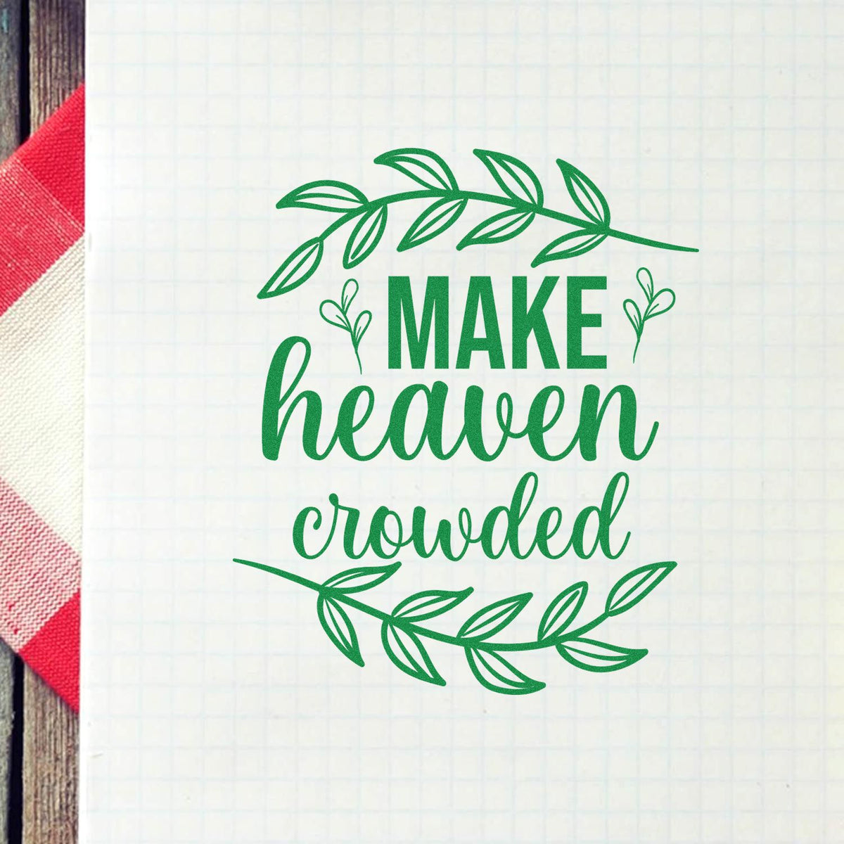 Green rubber stamp design with leafy wreath and the phrase Make Heaven Crowded for faith-based crafts and cards.
