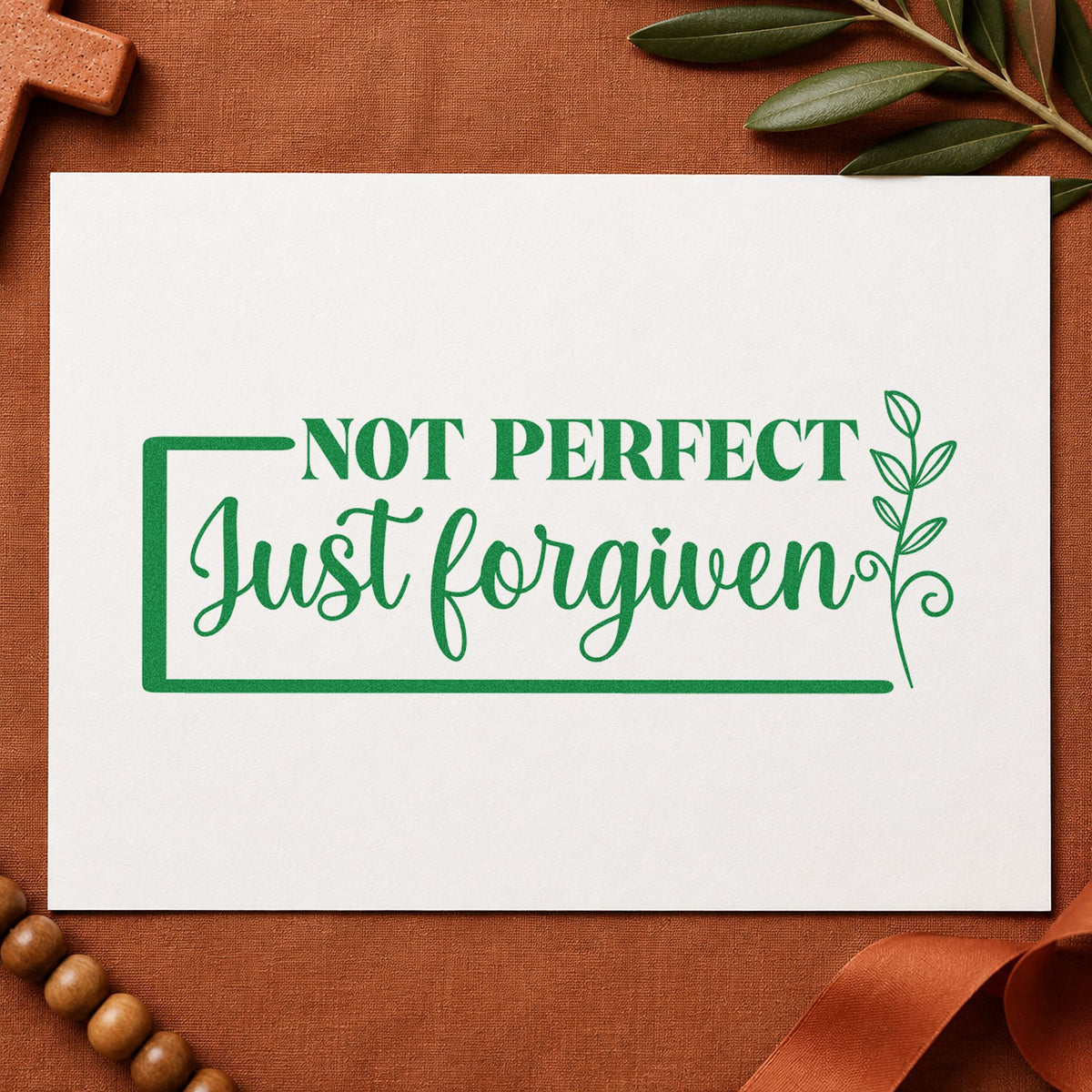 Not Perfect Forgiven Leaf Frame craft stamp imprint in green ink on a handmade project, one idea being fridge magnets.