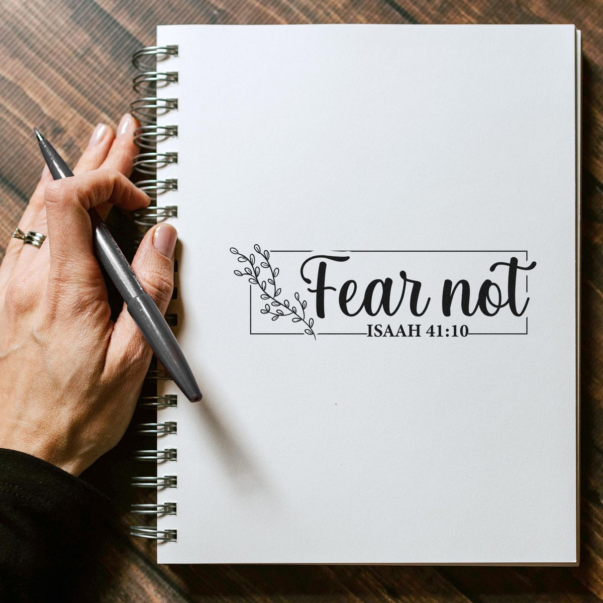 Bible verse rubber stamp saying Fear Not Isaiah 41:10 on a notebook page for journaling and faith-inspired crafts.