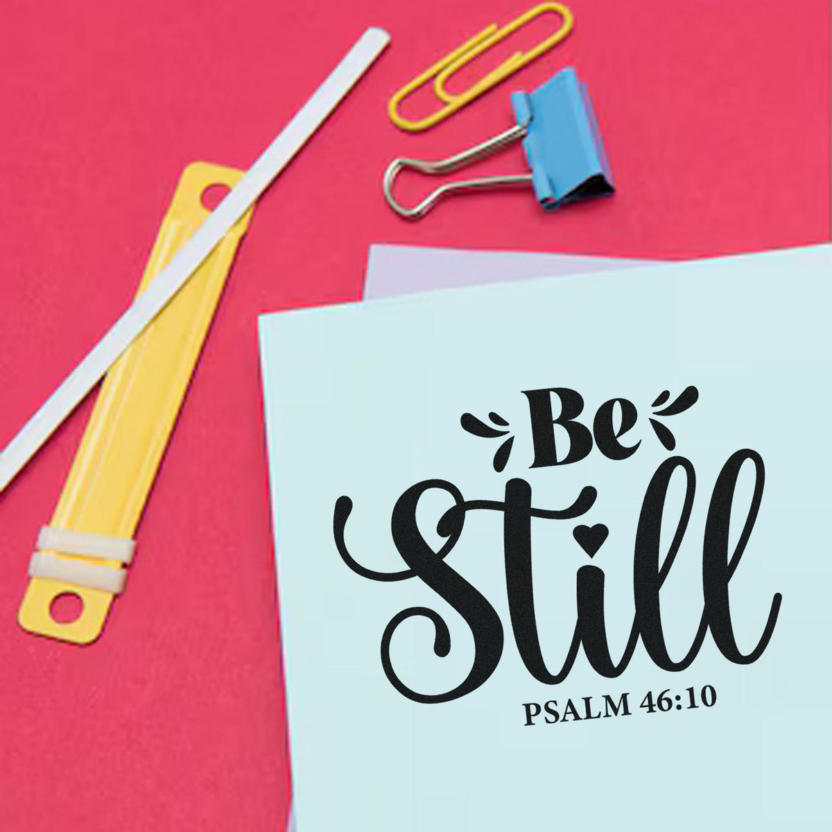 Christian Bible verse rubber stamp design with Be Still Psalm 46:10 on stationery and paper clips.
