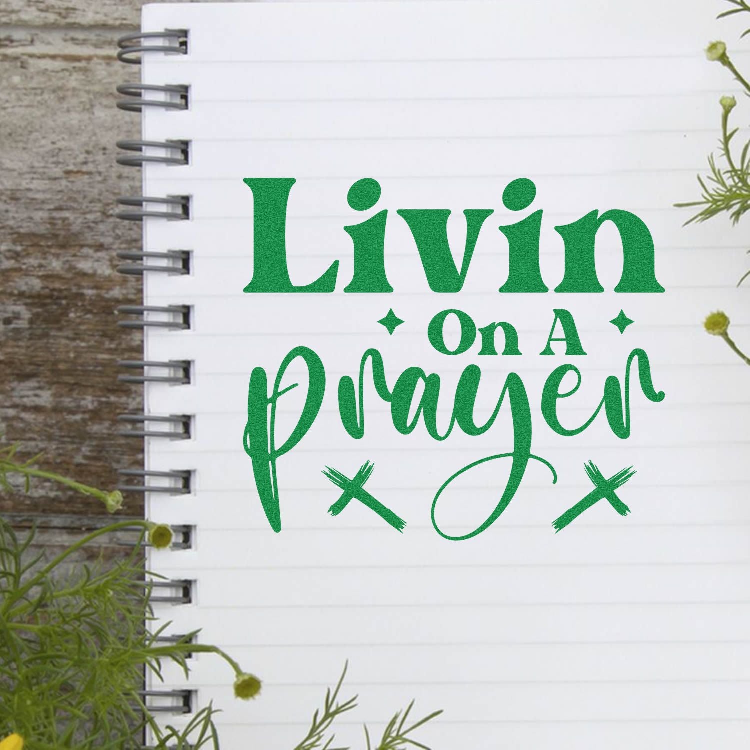 Livin on a Prayer custom rubber stamp design in green on a notebook mockup for journaling, crafting, and DIY projects.
