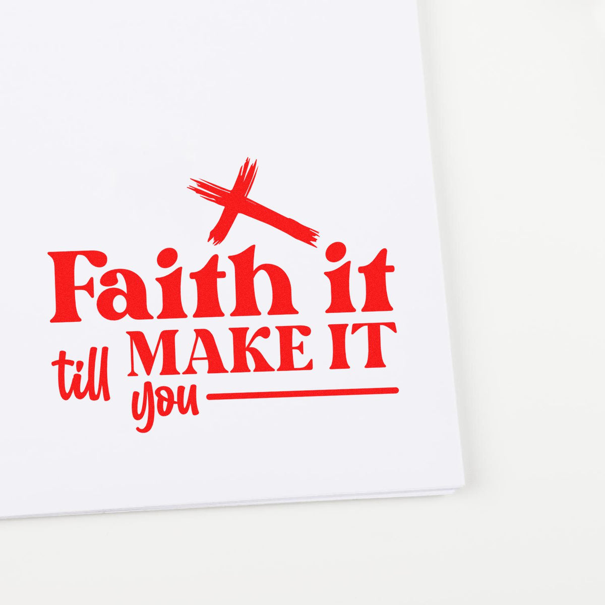 Red faith-based rubber stamp design with cross and motivational phrase Faith it till Make It.