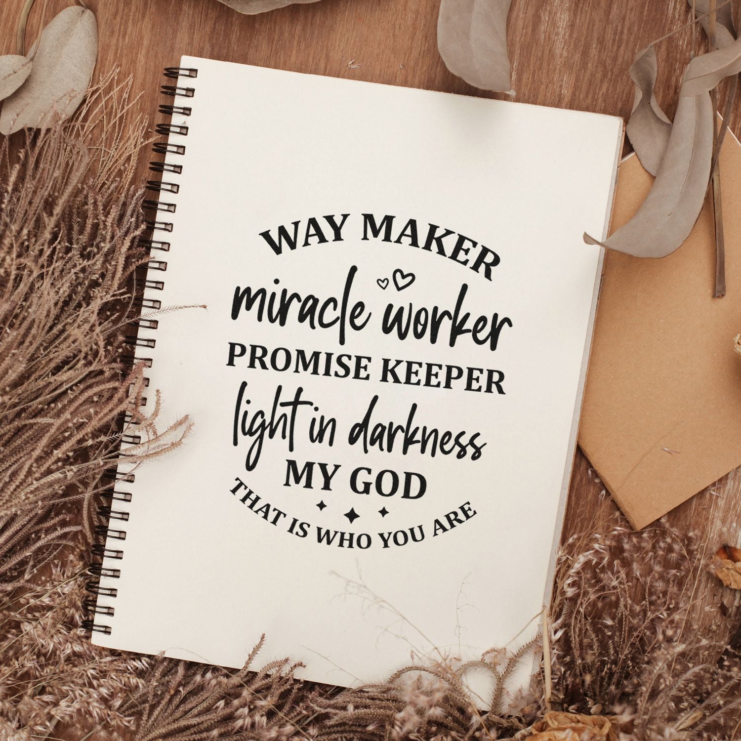 Christian rubber stamp design on notebook page with Way Maker, Miracle Worker, Promise Keeper faith quote.