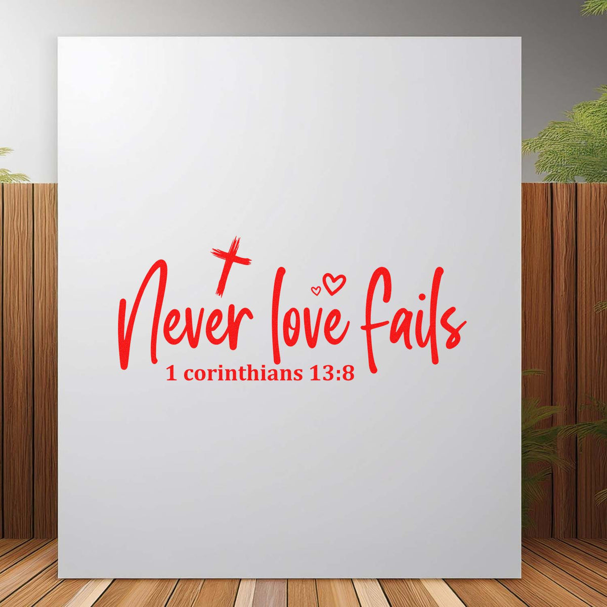 Red Christian rubber stamp design reading Never love fails with 1 Corinthians 13:8 and heart accents.