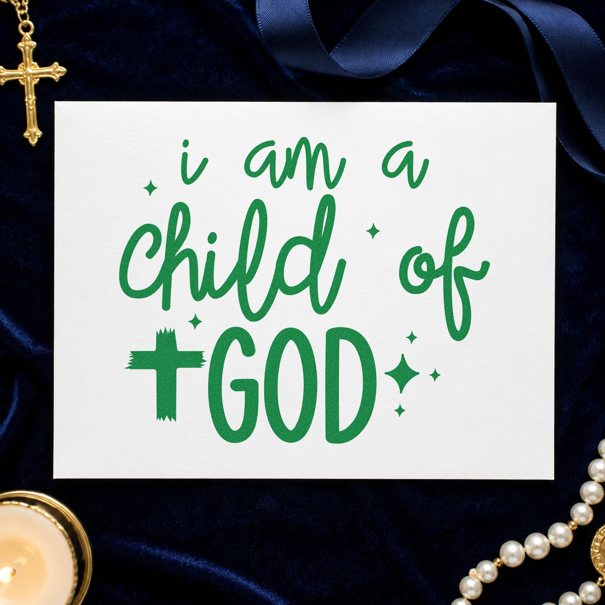 I Am a Child of God craft stamp imprint in green ink on a handmade project, one idea being kids' tees.