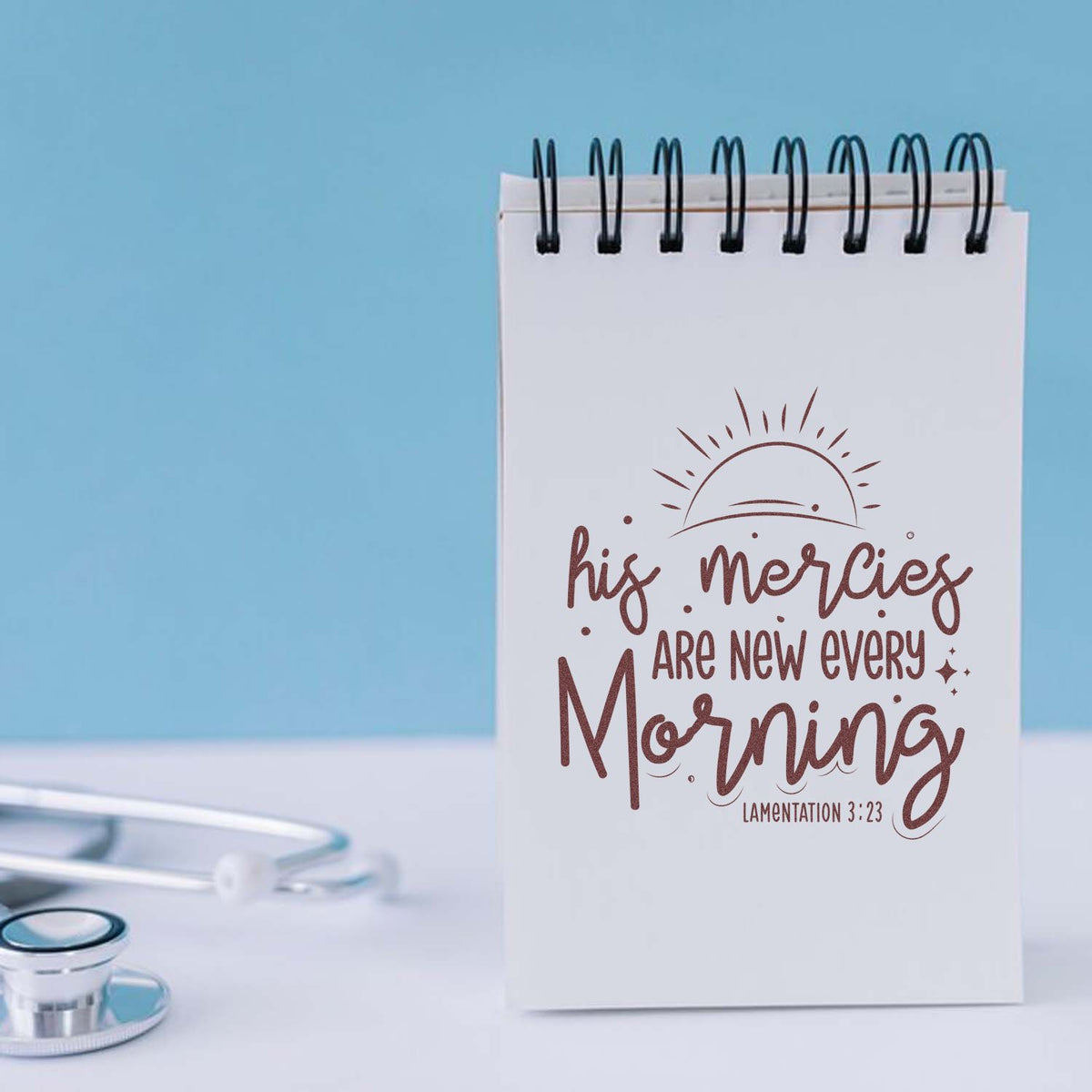 Christian rubber stamp with His mercies are new every morning scripture on spiral notebook, Lamentations 3:23.
