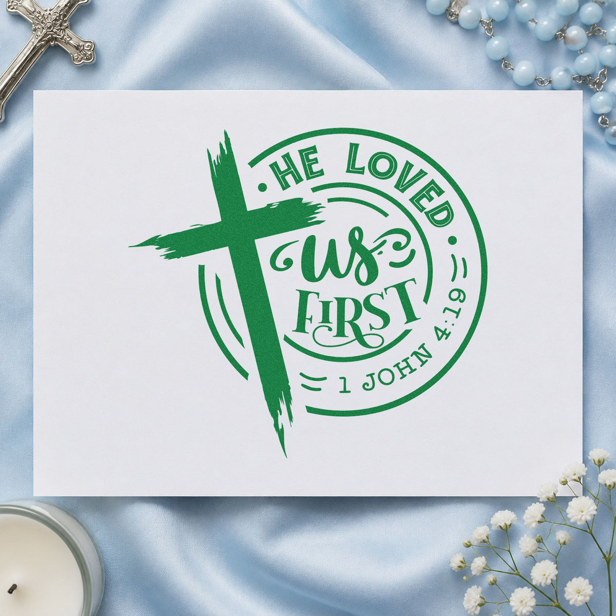 He Loved Us First Badge craft stamp imprint in green ink on a handmade project, one idea being framed entry art.