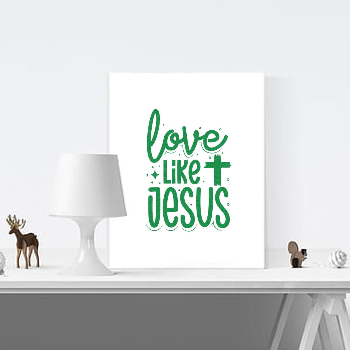 Love Like Jesus Christian rubber stamp design mockup on white canvas, featuring green lettering and a cross for faith-based crafts.