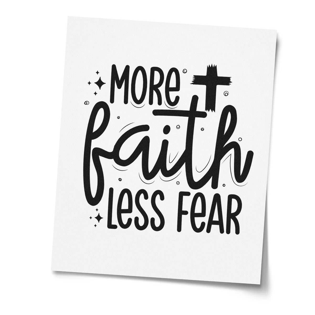 Christian rubber stamp design reading More faith less fear in bold black hand-lettering on white paper.