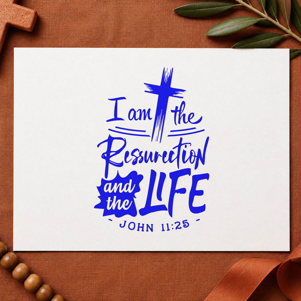 Resurrection and Life craft stamp imprinted in blue ink on paper, a design suited to sympathy bookmarks.