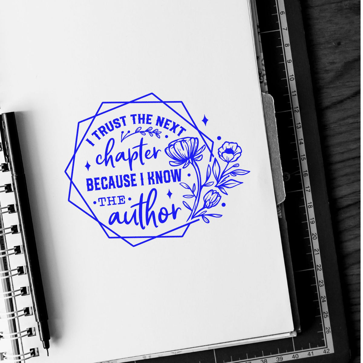 Inspirational rubber stamp design with floral motif, reading I trust the next chapter because I know the author for journals and planners.