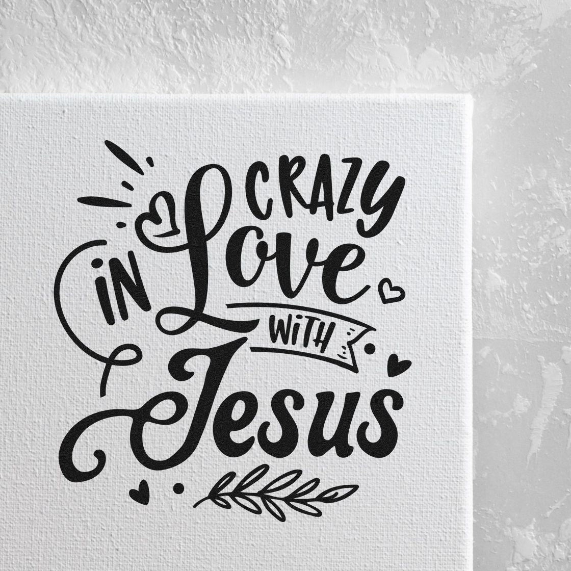 Hand-lettered rubber stamp design reading Crazy in Love with Jesus, with hearts and floral accents for Christian crafts.