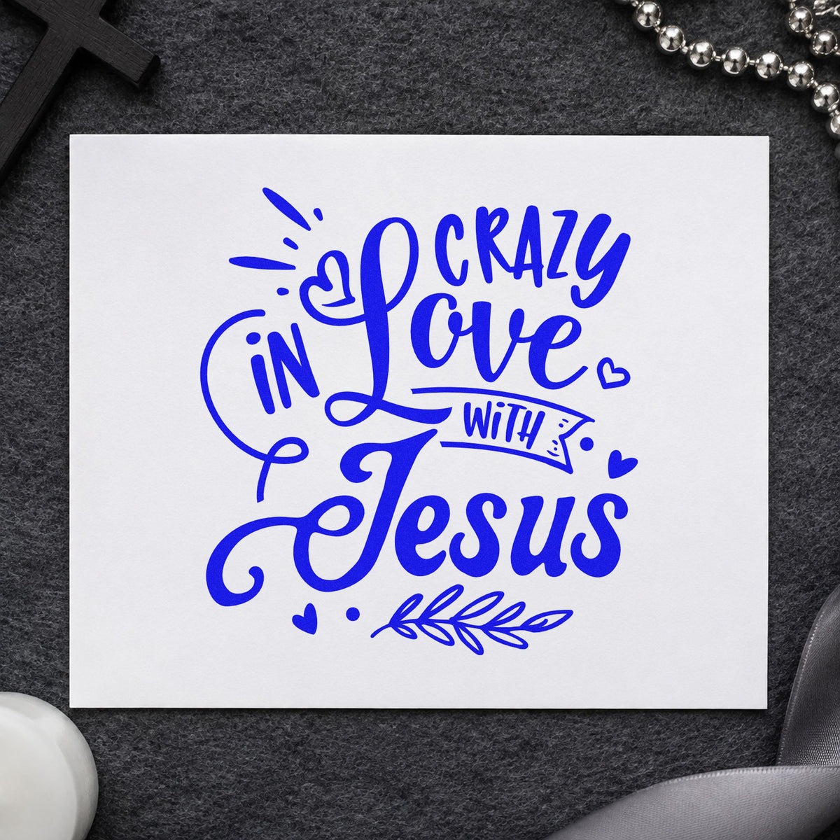 Crazy in Love with Jesus craft stamp imprinted in blue ink on paper, a design suited to baptism robe bags.