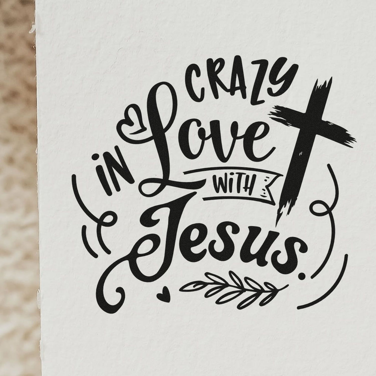 Crazy in Love with Jesus Christian rubber stamp design with cross, hearts and decorative script on white paper.