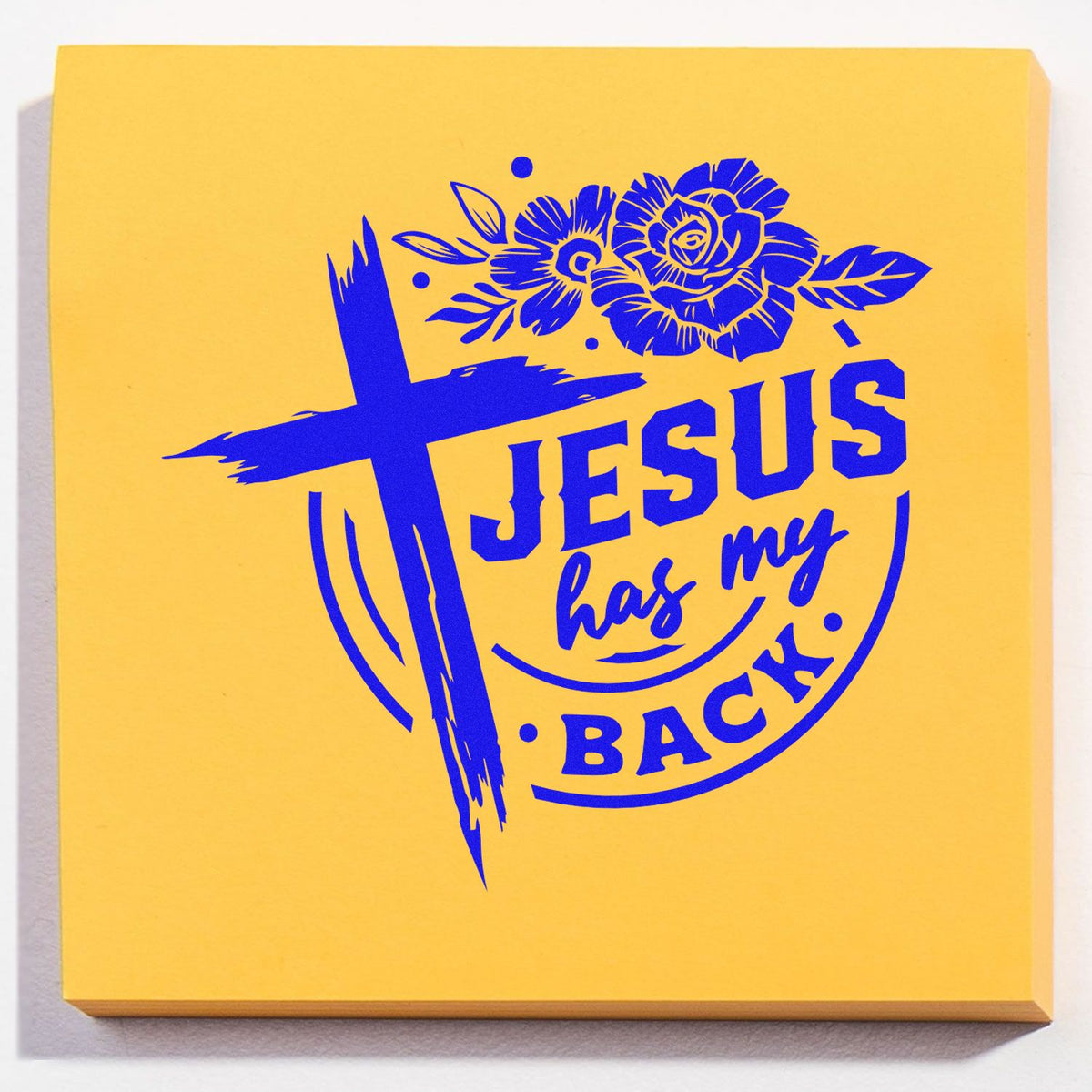Faith-based rubber stamp design reading Jesus has my back with cross and floral artwork in blue on yellow.