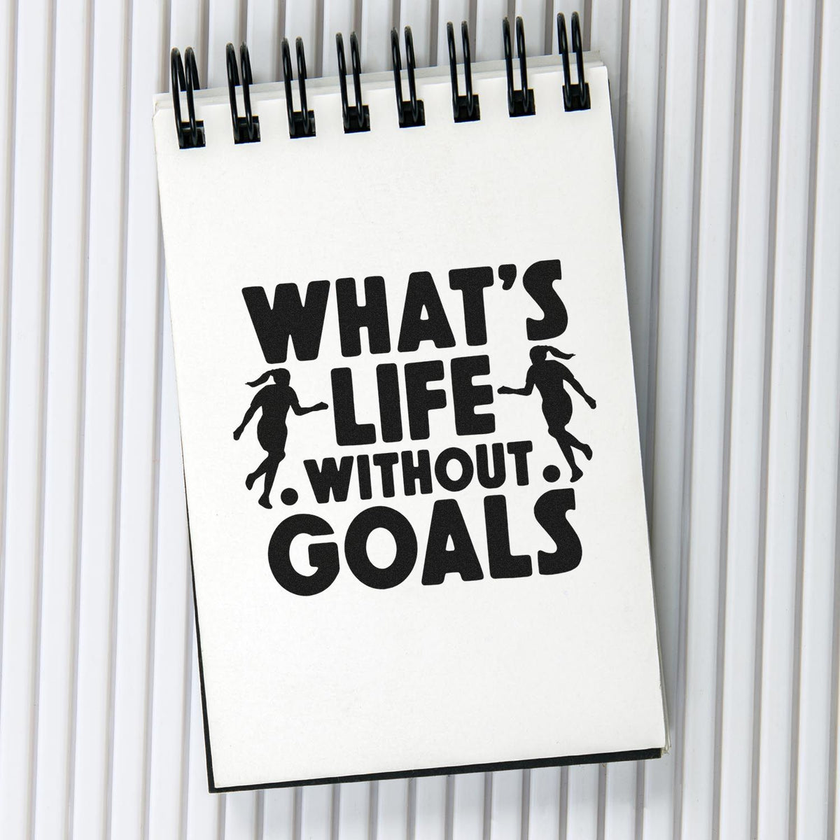 Life Without Goals Players Lettering PSI Pre-Inked Stamp imprint stamped in black ink. Two soccer player silhouettes flank bold "What's life without goals" lettering.