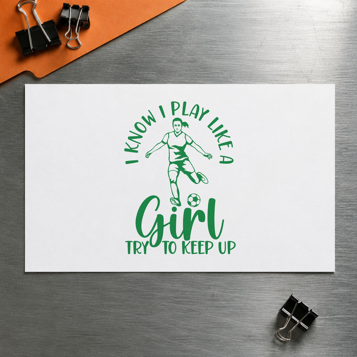 I Play Like a Girl craft stamp imprint in green ink on a handmade project, one idea being framed bedroom wall.