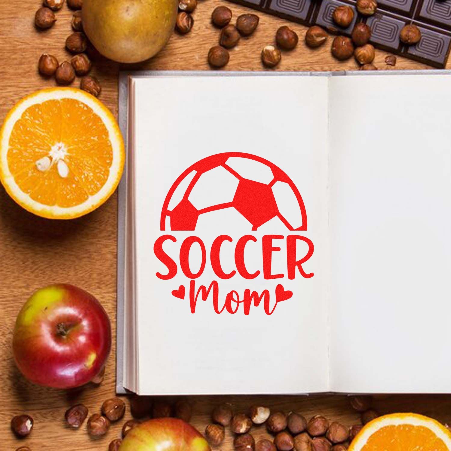 Soccer mom rubber stamp design with soccer ball and hearts, ideal for sports-themed scrapbooking, crafts, and stationery.