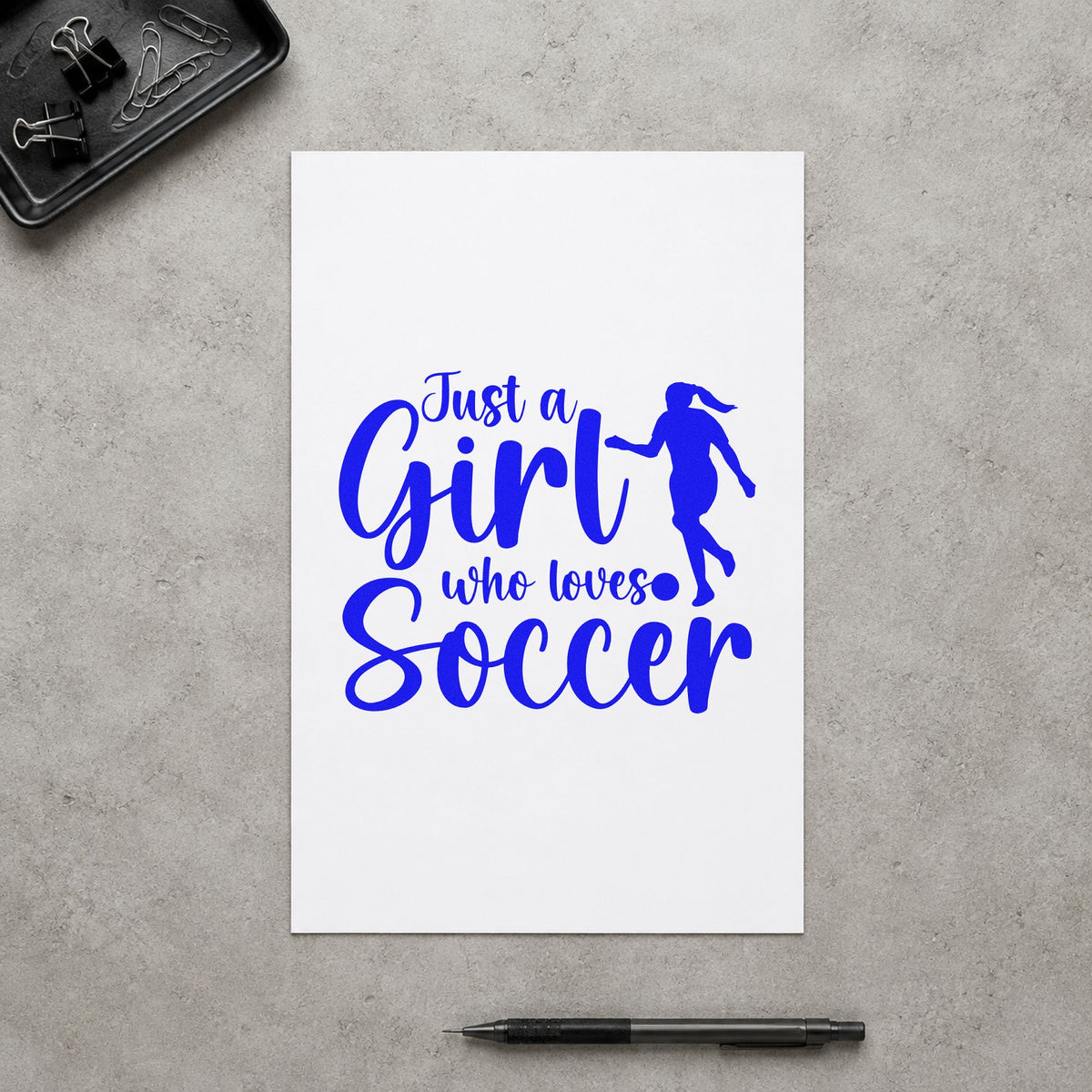 Girl Who Loves Soccer Silhouette craft stamp imprinted in blue ink on paper, a design suited to water cooler labels.