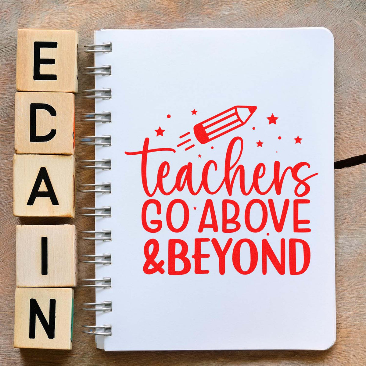 Teacher appreciation rubber stamp design with Go Above & Beyond on a notebook, perfect for classroom rewards and gifts.