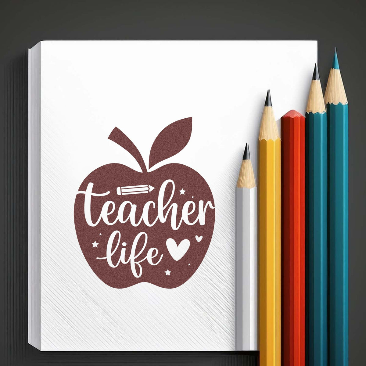 Teacher life rubber stamp design in an apple shape for classroom planners, notebooks, and school craft projects.