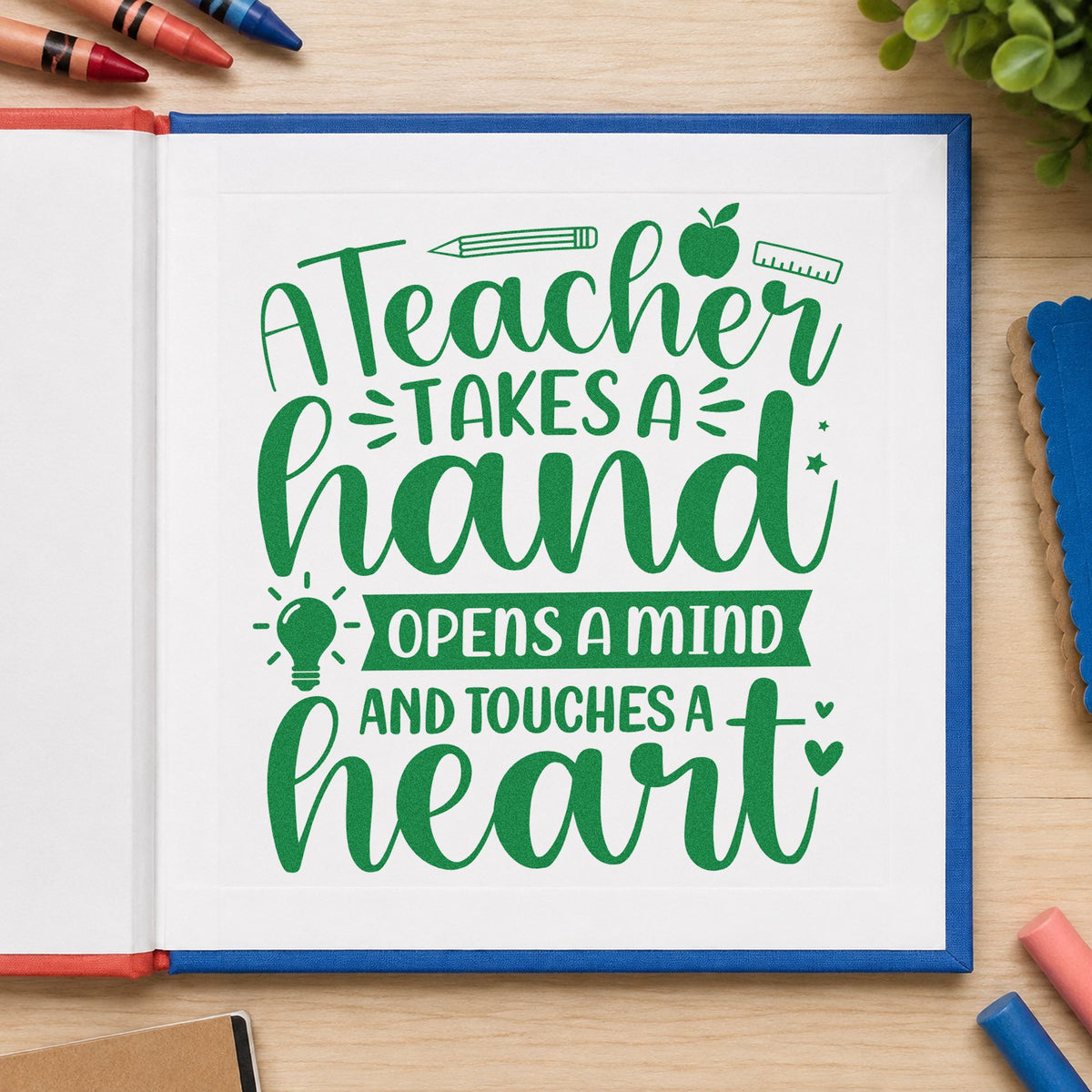 Teacher Touches a Heart craft stamp imprint in green ink on a handmade project, one idea being portfolio cover pages.
