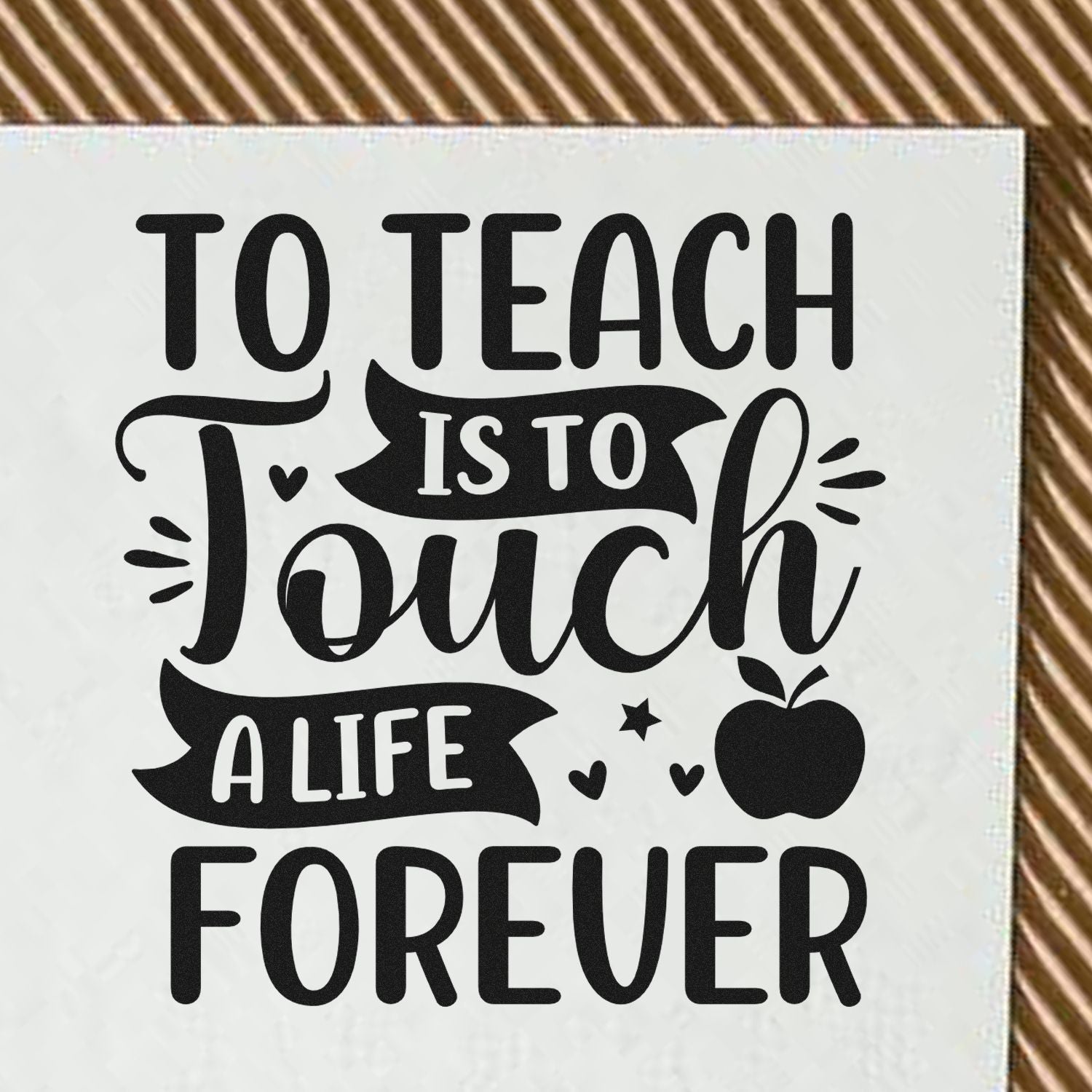 Teacher rubber stamp design with To Teach Is To Touch a Life Forever slogan and apple icon