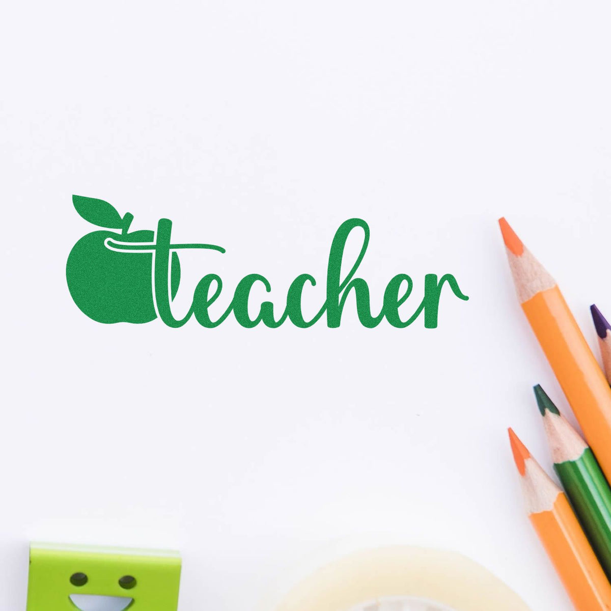 Green teacher apple rubber stamp design on white paper, ideal for classroom labels, education crafts, and teacher stationery.