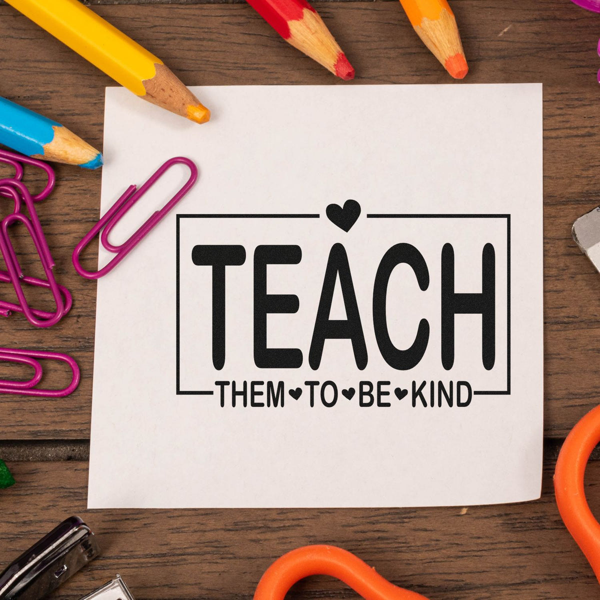 Teacher rubber stamp design reading Teach Them to Be Kind for classroom crafts, educator gifts, and school projects.