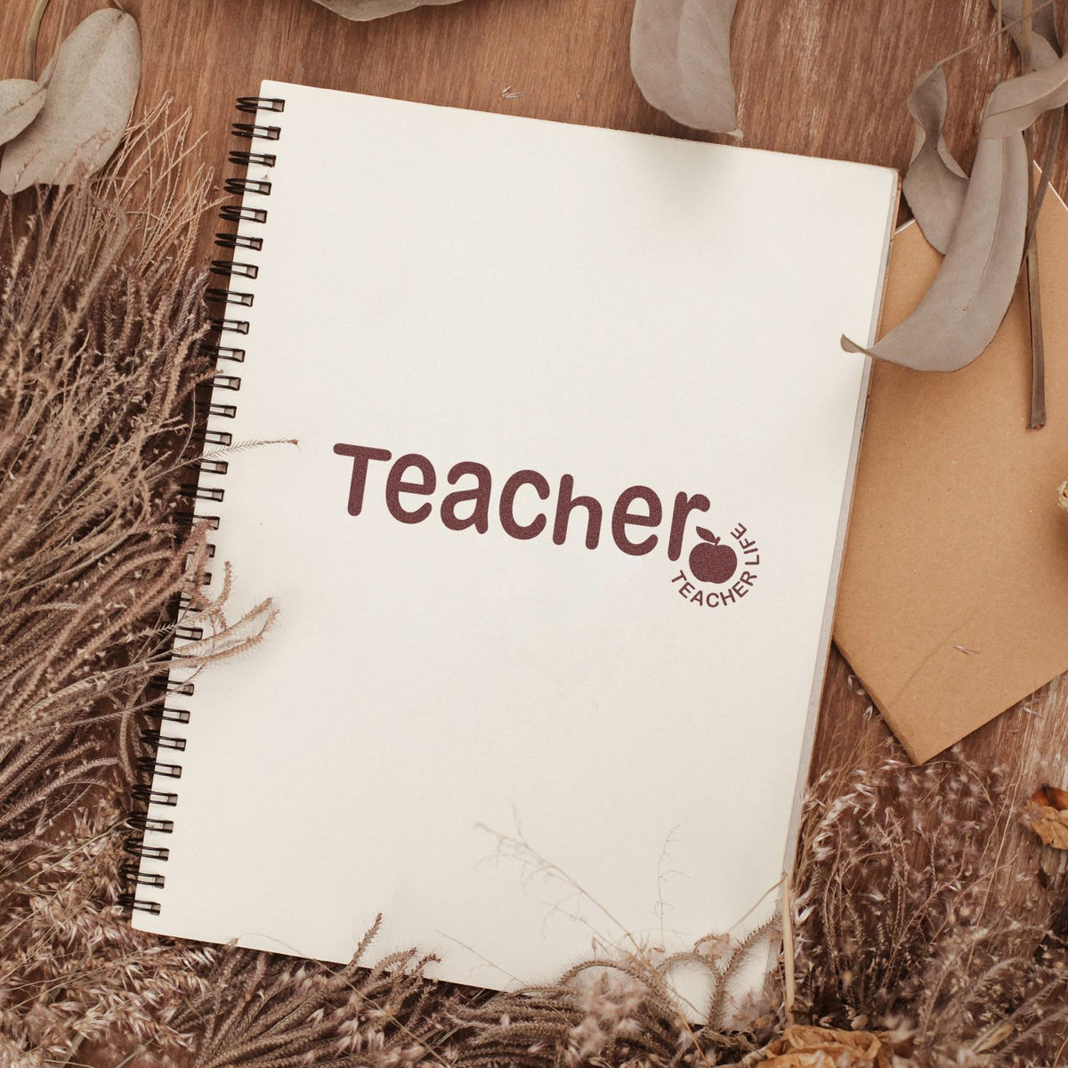 Teacher rubber stamp on spiral notebook, ideal for classroom notes, grading, and personalized teacher stationery.