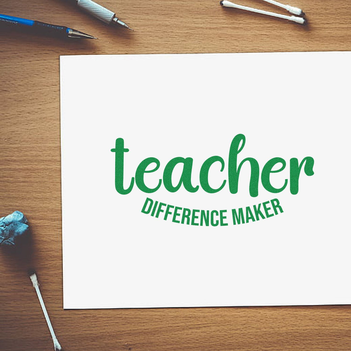 Teacher difference maker rubber stamp design on white card, ideal for classroom appreciation and custom teacher gifts.